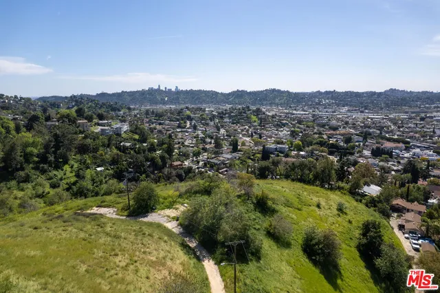 an aerial view of residential house and green space