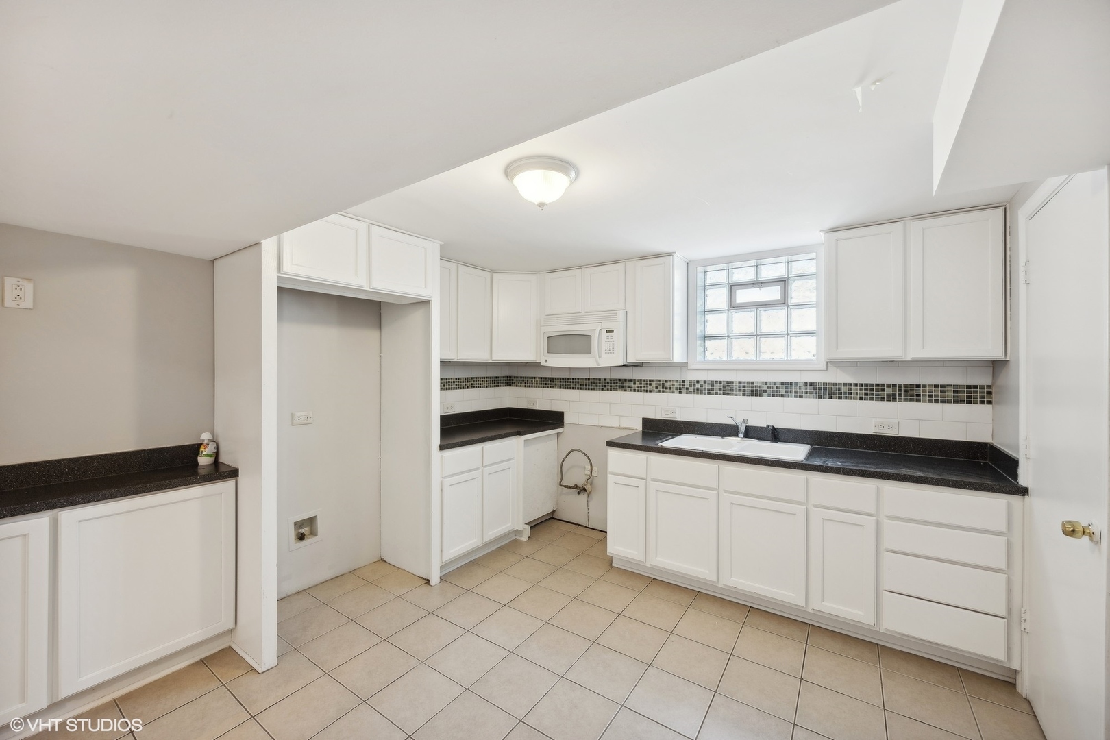 8152 Mayfield Avenue Burbank, IL 60459 - Photo 19 of 27 a kitchen with white cabinets and white appliances