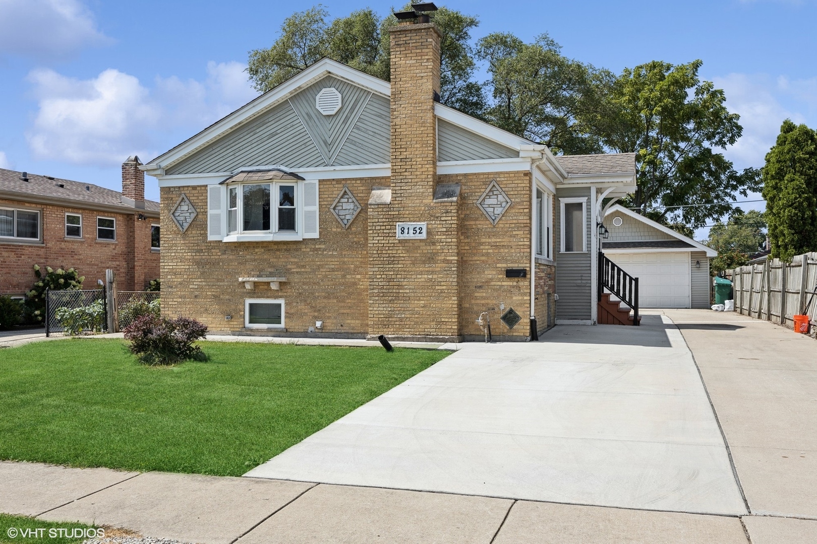 8152 Mayfield Avenue Burbank, IL 60459 - Photo 2 of 27 a front view of a house with a yard