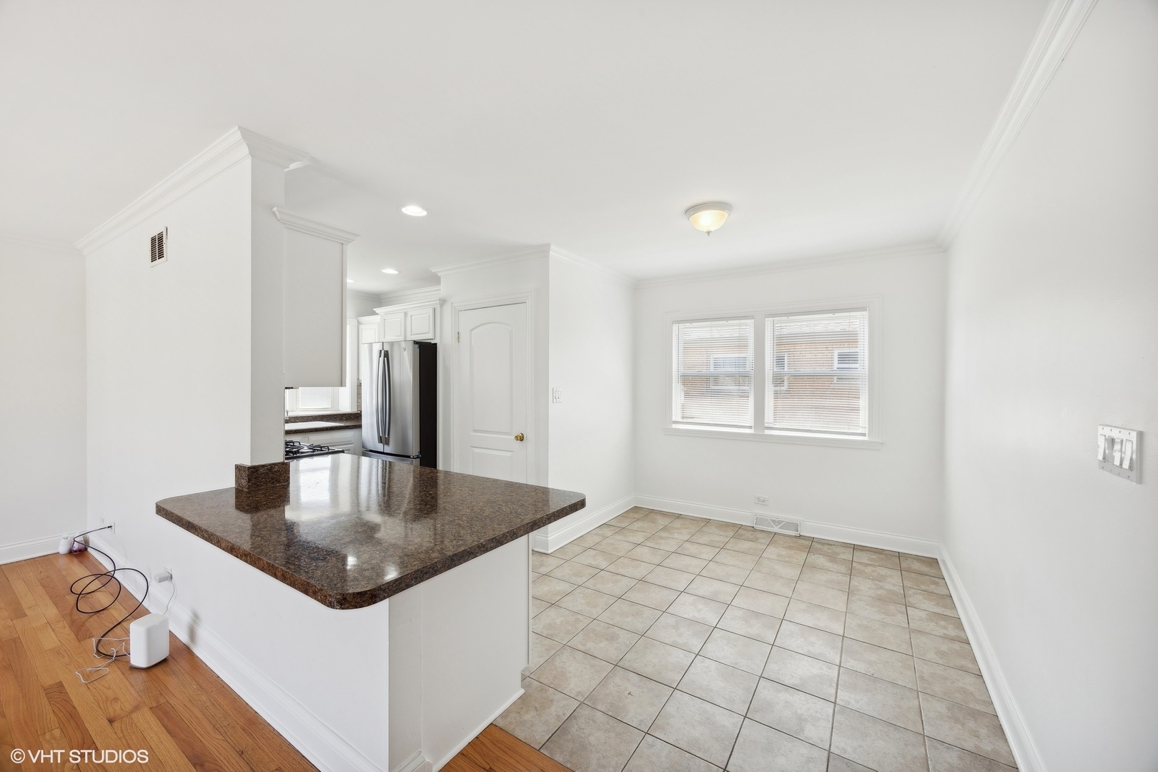 8152 Mayfield Avenue Burbank, IL 60459 - Photo 7 of 27 a kitchen with stainless steel appliances granite countertop a sink a refrigerator and window
