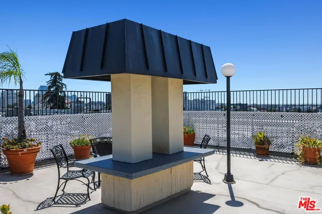 a view of a street with sitting area