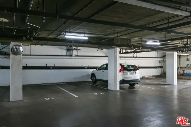 a front view of a building with plants