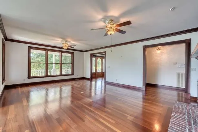 a view of entryway with wooden floor and stairs