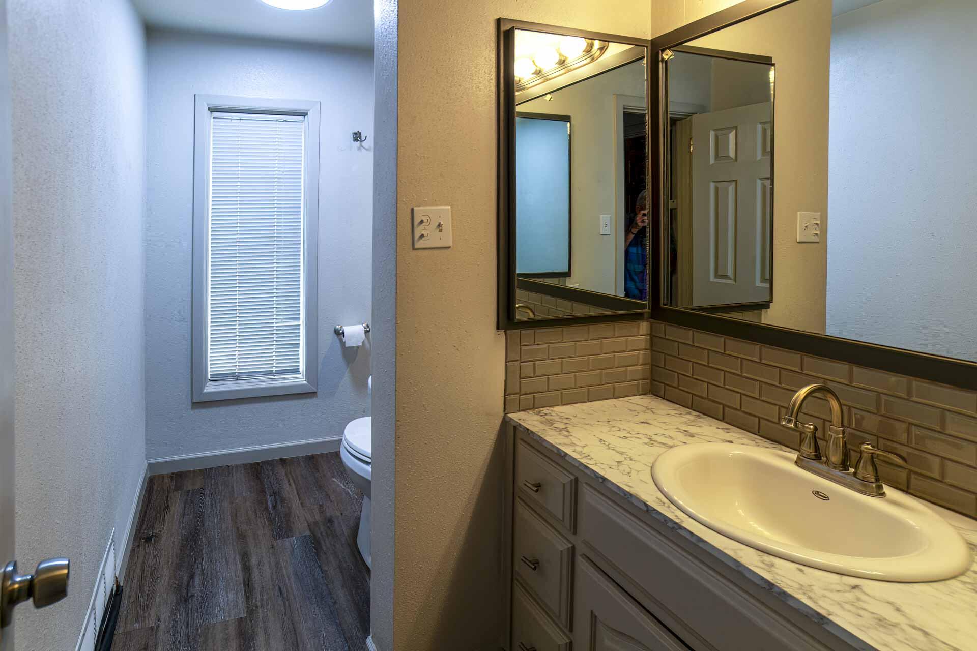 2136 57th Street Lubbock, TX 79412 - Photo 25 of 41 a bathroom with a sink and a mirror