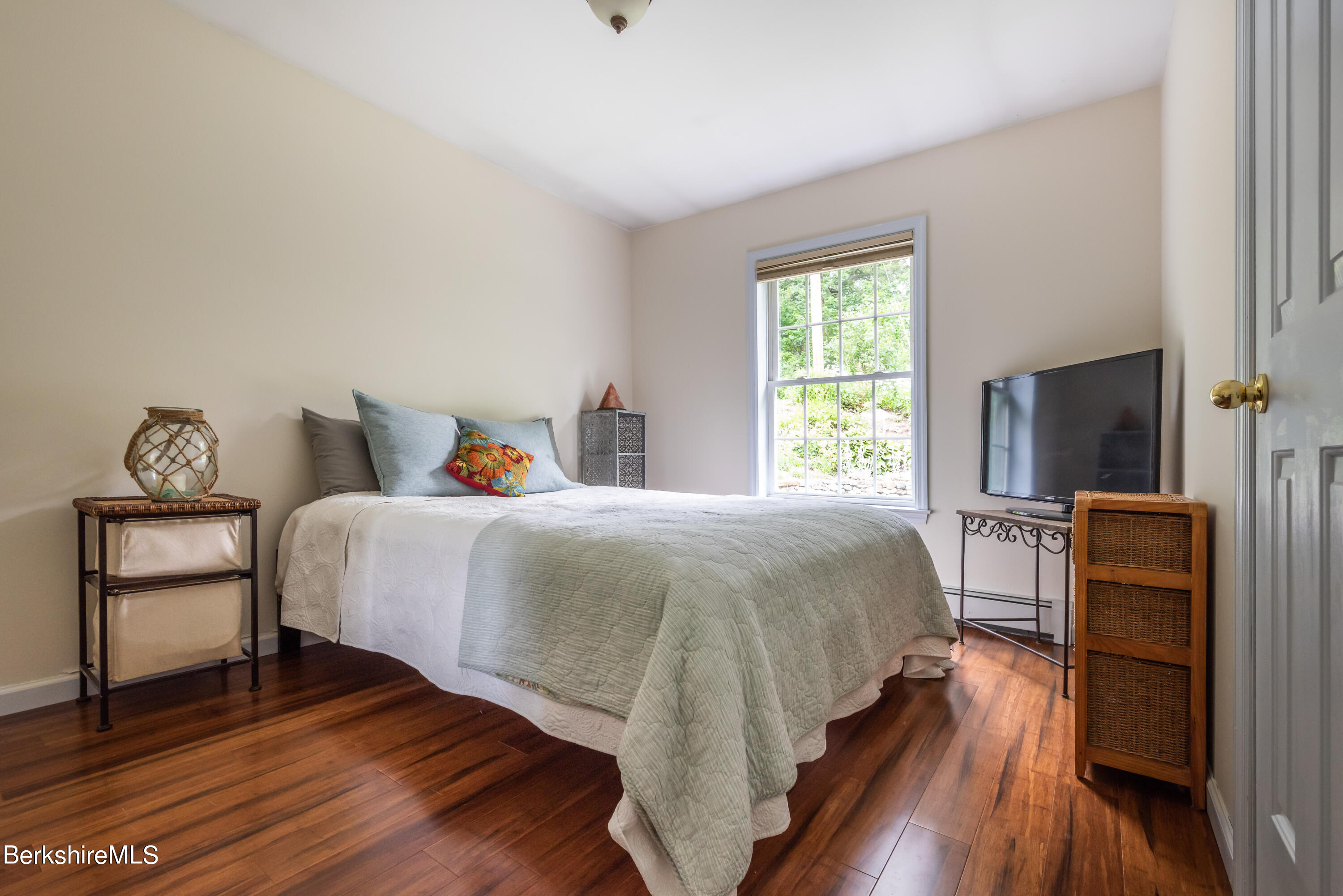 15 Alma Street Pittsfield, MA 01201 - Photo 21 of 35 a bedroom with a bed and a flat screen tv