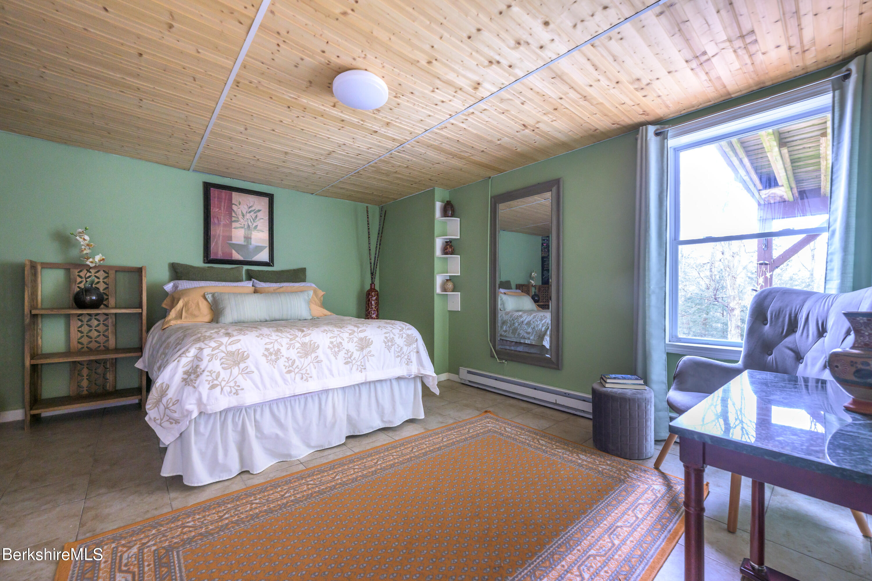 15 Alma Street Pittsfield, MA 01201 - Photo 22 of 35 a bedroom with a bed and a chandelier