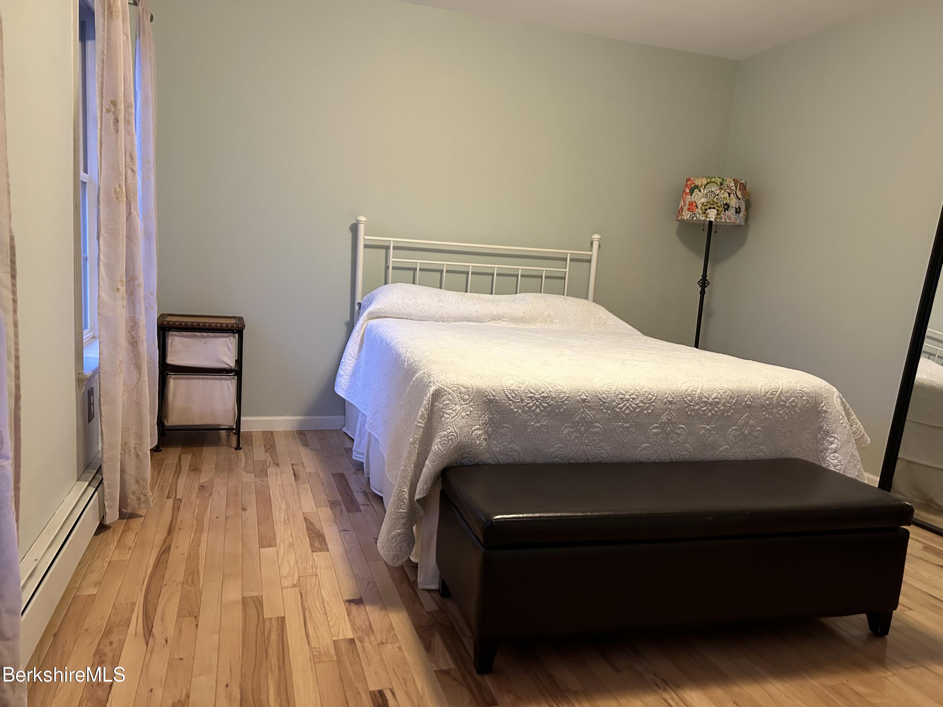 15 Alma Street Pittsfield, MA 01201 - Photo 34 of 35 a bedroom with a bed and a table