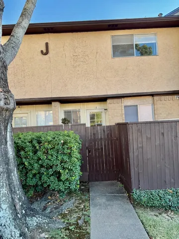 a couple of potted plants in front of door