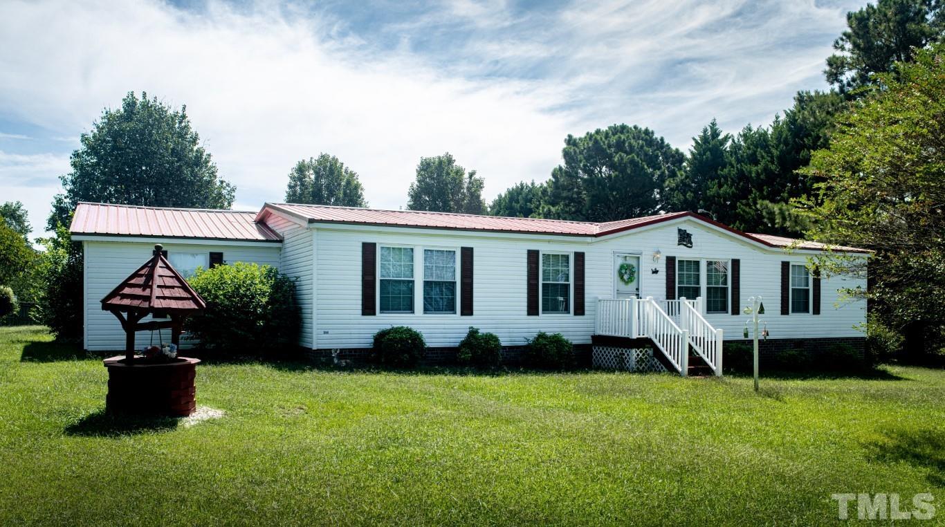 12411 West Old Spring Hope Road Middlesex, NC 27557 - Photo 1 of 28 a front view of house with yard and green space