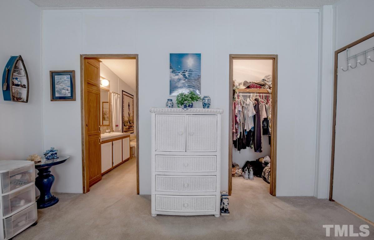 12411 West Old Spring Hope Road Middlesex, NC 27557 - Photo 16 of 28 a view of walk in closet with clothes and shoes