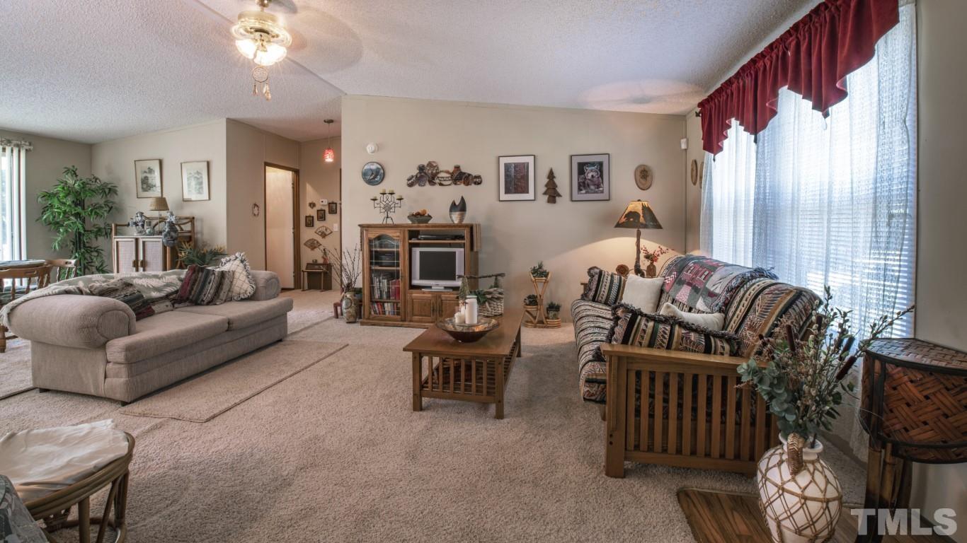12411 West Old Spring Hope Road Middlesex, NC 27557 - Photo 3 of 28 a living room with furniture and wooden floor