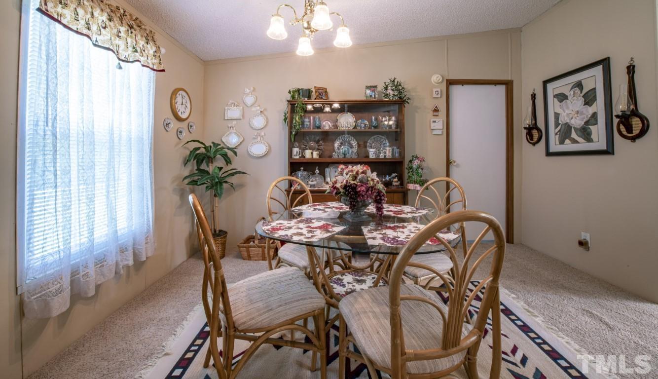 12411 West Old Spring Hope Road Middlesex, NC 27557 - Photo 5 of 28 a view of a dining room with furniture and window