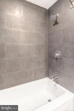 a bathroom with a sink vanity and a mirror