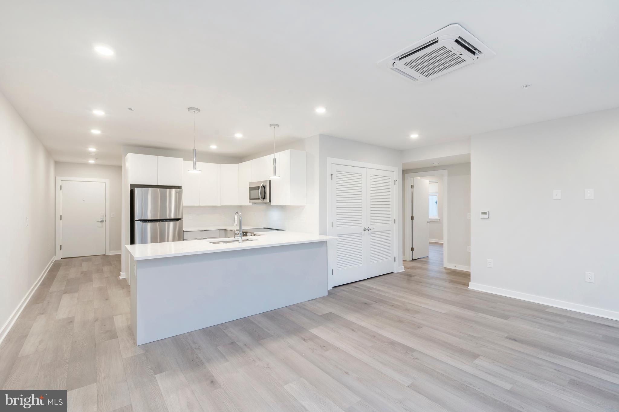 3449 Scotts Lane, Unit B323 Philadelphia, PA 19129 - Photo 5 of 21 a view of kitchen with wooden floor