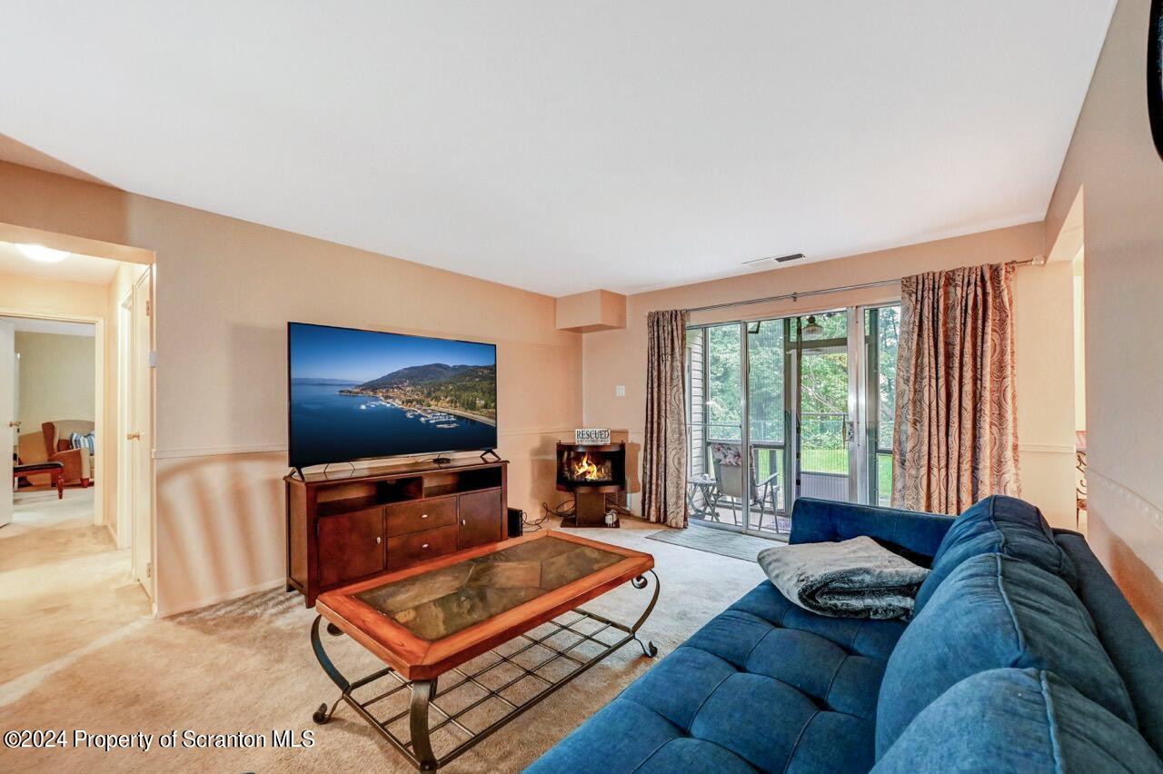 1102 Summit Pointe Scranton, PA 18508 - Photo 16 of 37 a living room with furniture and a flat screen tv