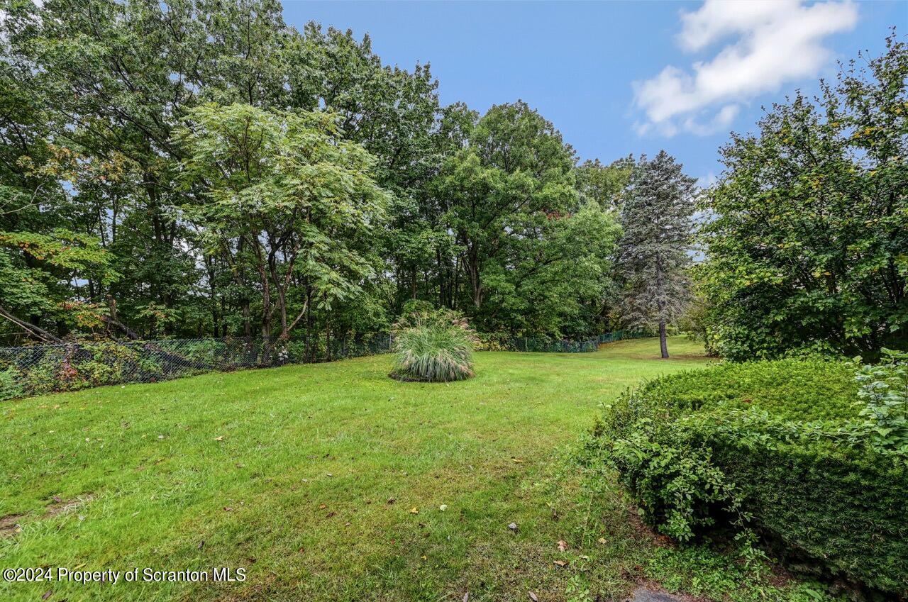 1102 Summit Pointe Scranton, PA 18508 - Photo 35 of 37 a view of a field with a trees in the background