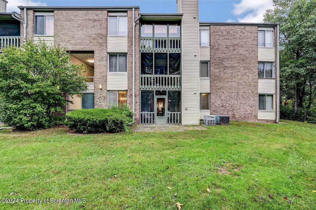1102 Summit Pointe Scranton, PA 18508 - Photo 4 of 37 front view of a brick house with a large windows