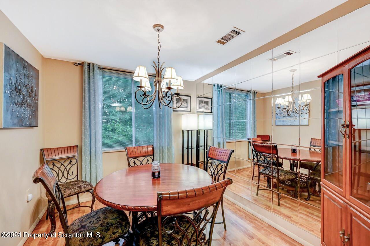 1102 Summit Pointe Scranton, PA 18508 - Photo 10 of 37 a view of a dining room with furniture window and outside view