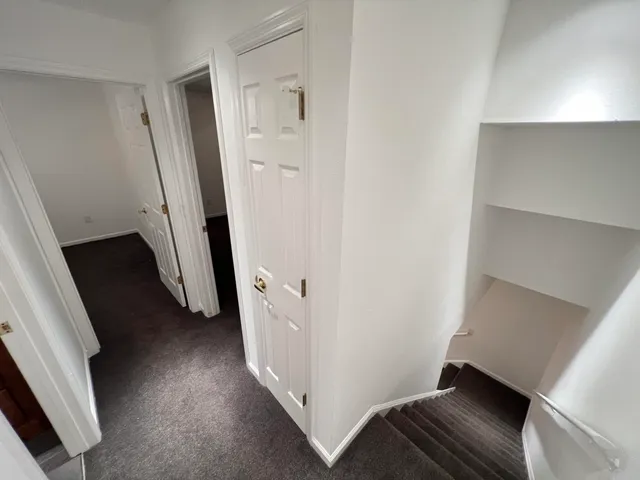 wooden floor in a hall with an entryway