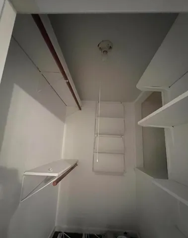 a view of a room with racks on the wall