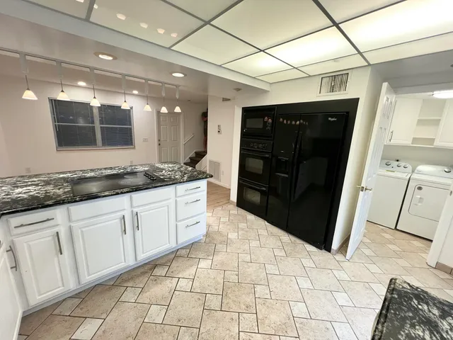 a bathroom with a sink a vanity and a mirror