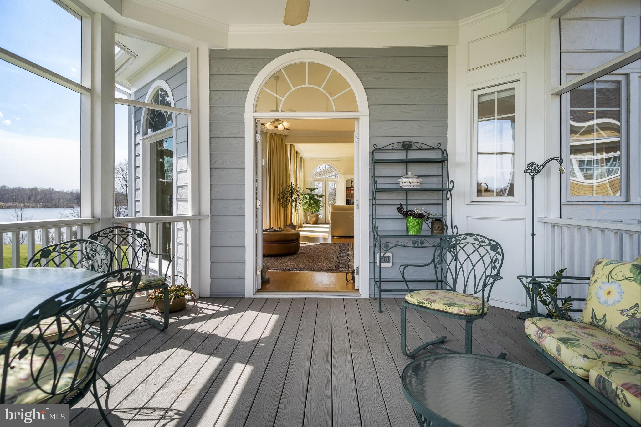 8514 Link Hills Loop Gainesville, VA 20155 - Photo 20 of 65 East Side Screened in Porch looking into Sunroom