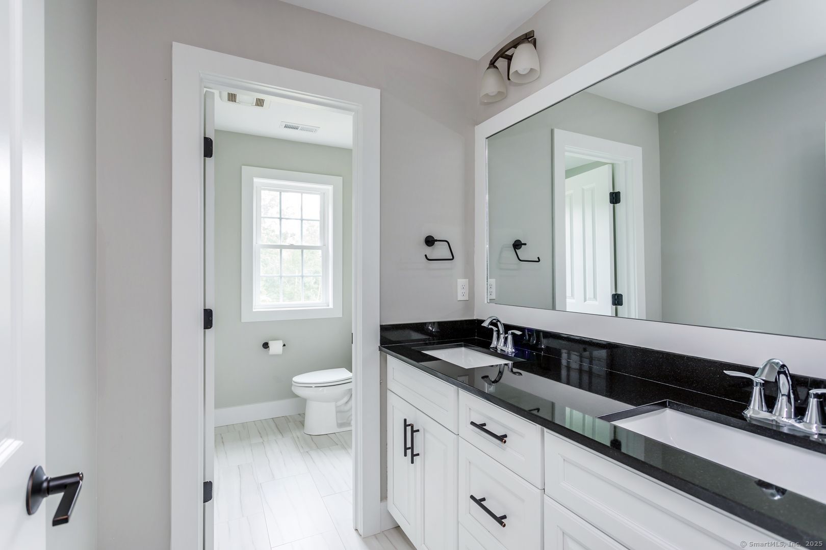 Lot1 Deerwood Road Oxford, CT 06478 - Photo 11 of 33 a spacious bathroom with a granite countertop sink and a mirror