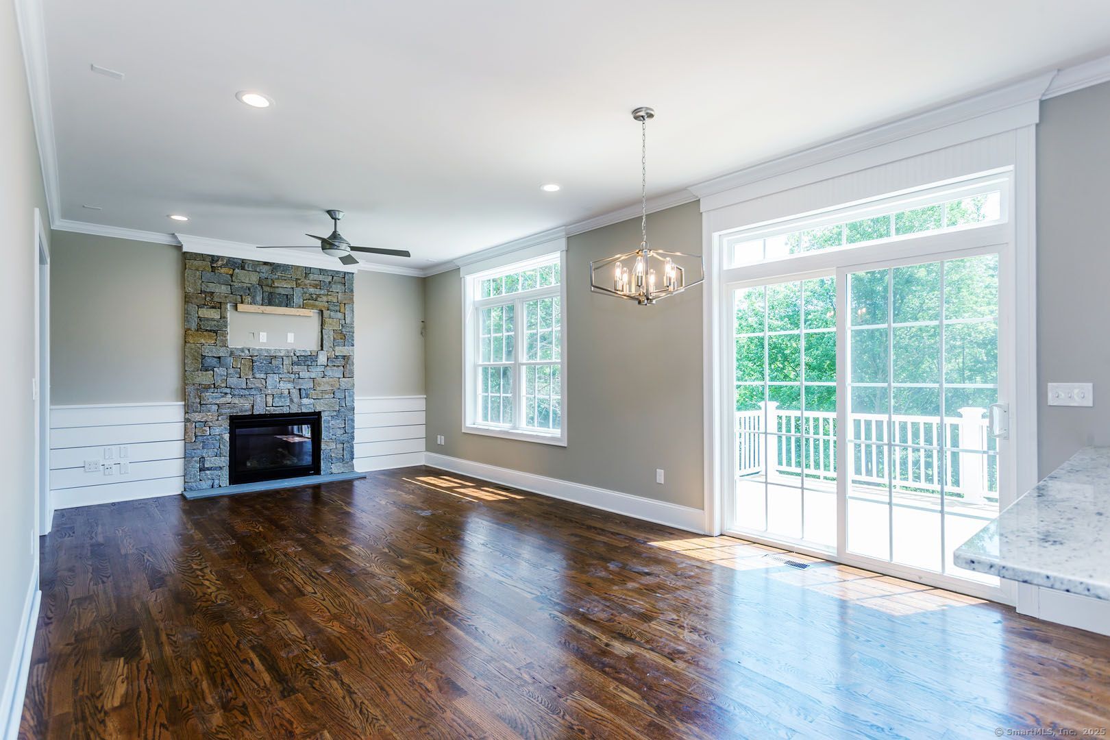 Lot1 Deerwood Road Oxford, CT 06478 - Photo 24 of 33 a view of a livingroom with a fireplace wooden floor and window
