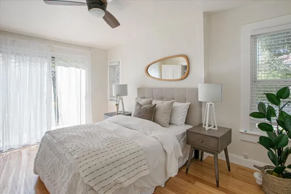 a view of a patio with table and chairs and potted plants