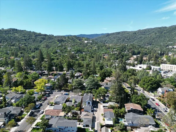an aerial view of a house with a yard