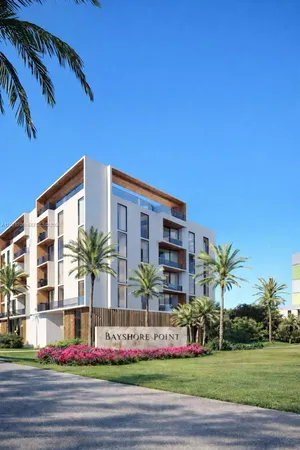 a palm tree sitting in front of a building