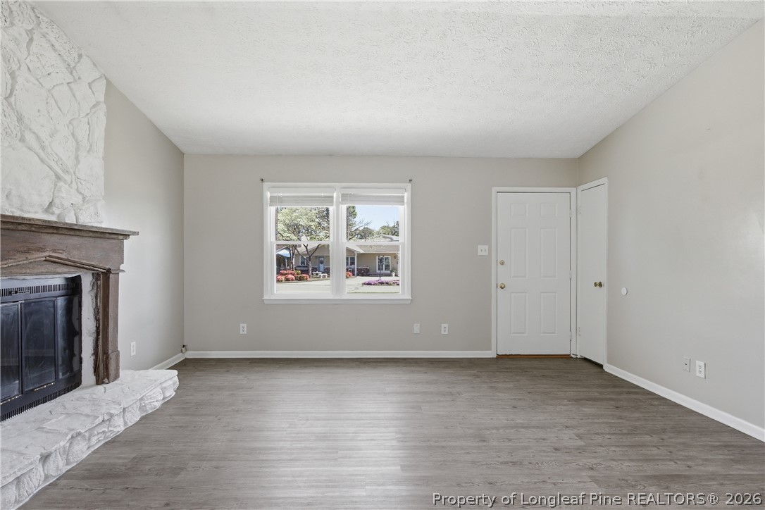 6319 Rustic Ridge Hope Mills, NC 28348 - Photo 8 of 39 an empty room with wooden floor and a window