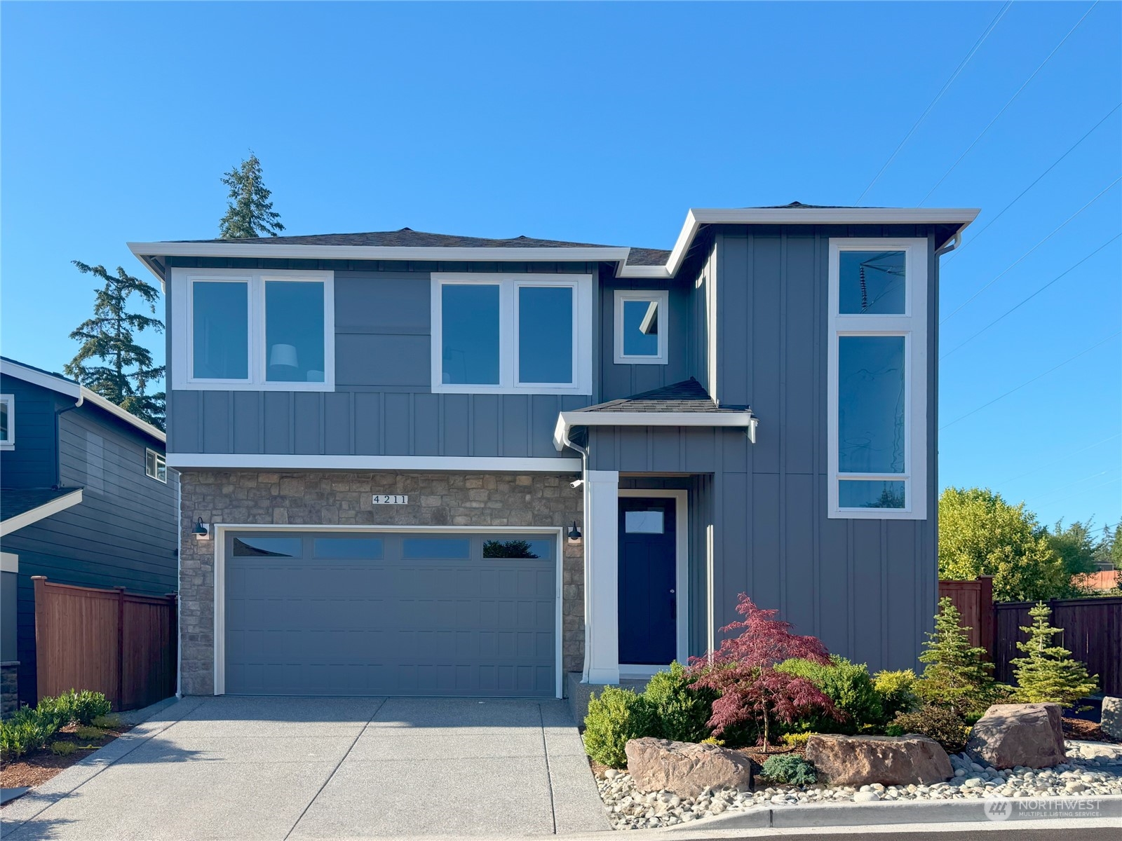 4211 217th Place Southeast Bothell, WA 98021 - Photo 1 of 26 a front view of a house