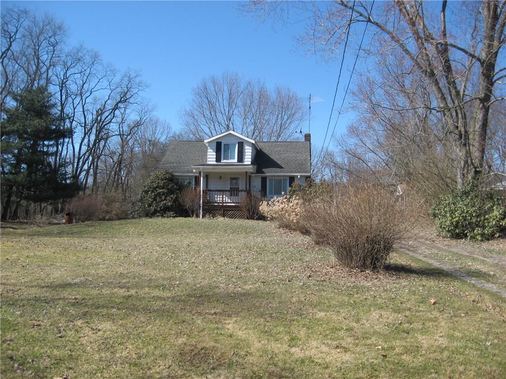 Front view of home.  Tucked back off Route 38 giving privacy from the road. Beautiful 2+acres of level property.