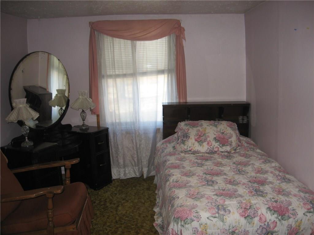 2425 Oneida Valley Road Petrolia, PA 16050 - Photo 12 of 21 MIDDLE BEDROOM UPSTAIRS. BIG ENOUGH TO MAKE A FULL BATH ON SECOND FLOOR IF YOU DO NOT NEED 4 BEDROOMS.