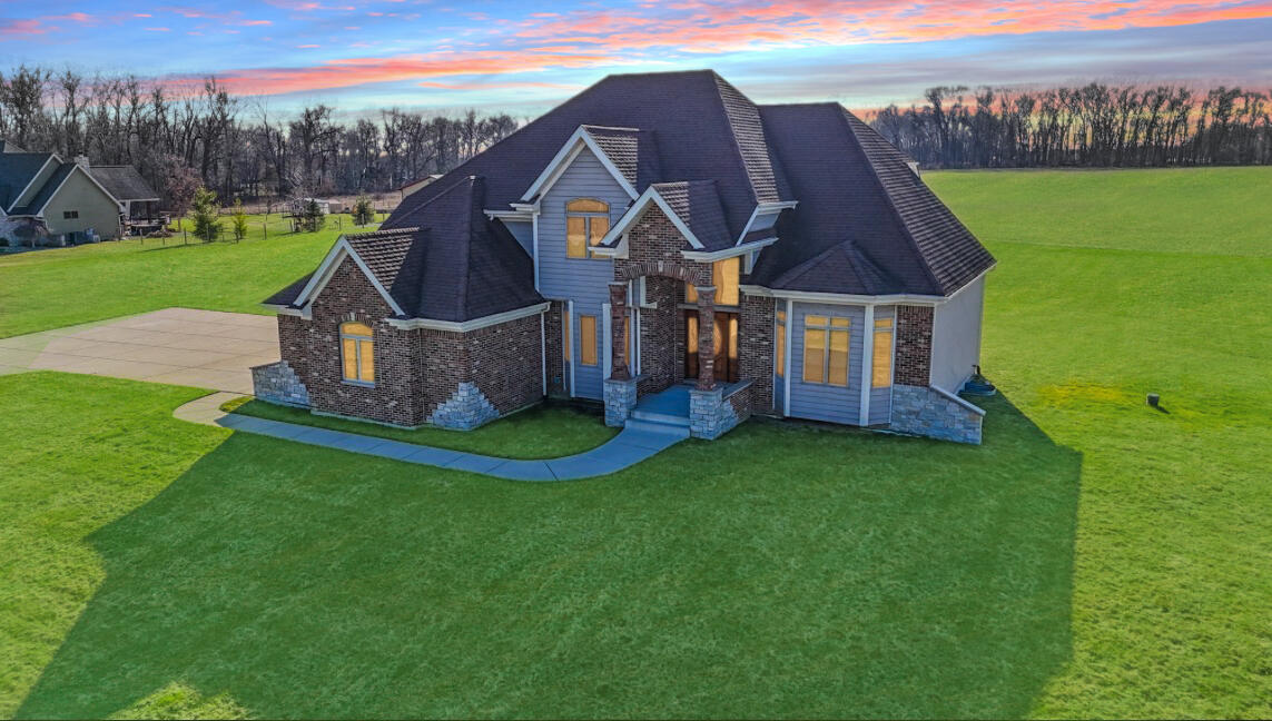 17826 South County Line Road Hebron, IN 46341 - Photo 1 of 67 a front view of a house with garden