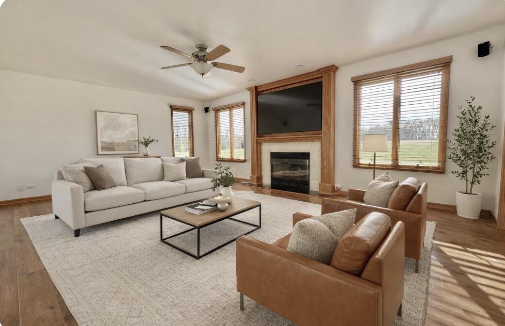 17826 South County Line Road Hebron, IN 46341 - Photo 7 of 67 a living room with furniture ceiling fan and a fireplace