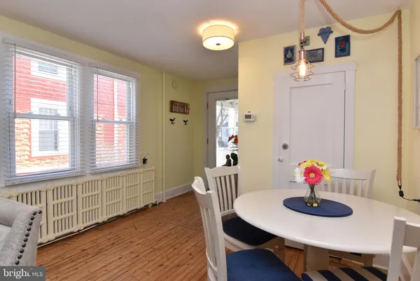 a kitchen with stainless steel appliances a refrigerator a sink a stove and cabinets