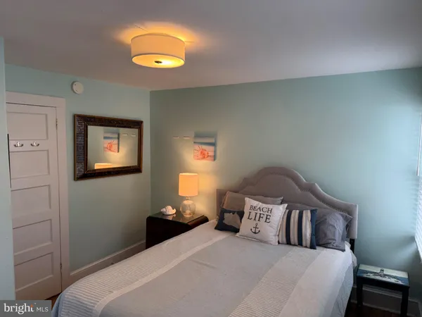 a bed room with a bed and a television