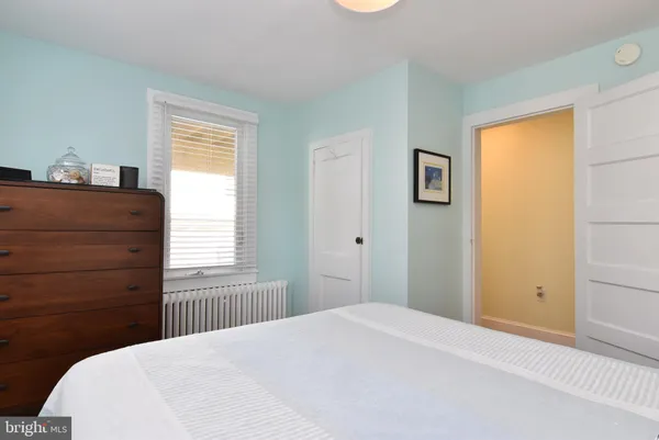 a bedroom with a bed and furniture