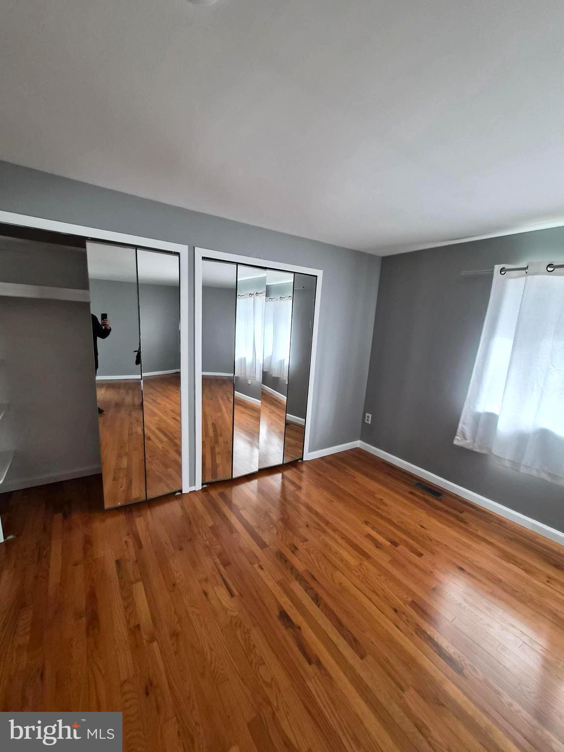 7120 Winter Rose Path Columbia, MD 21045 - Photo 17 of 28 a view of empty room with wooden floor