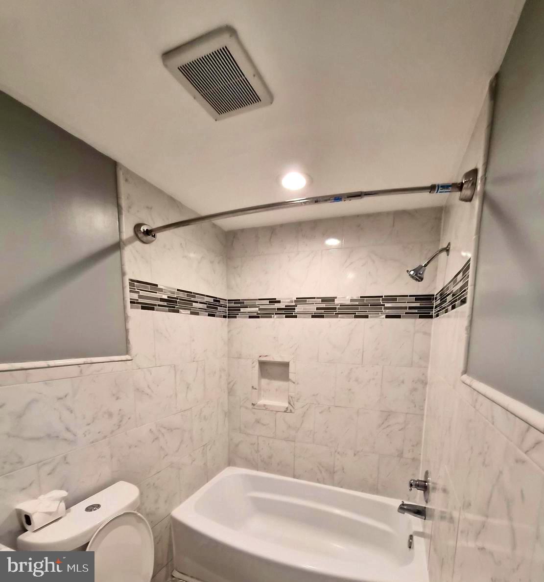 7120 Winter Rose Path Columbia, MD 21045 - Photo 18 of 28 a bathroom with a shower and a toilet