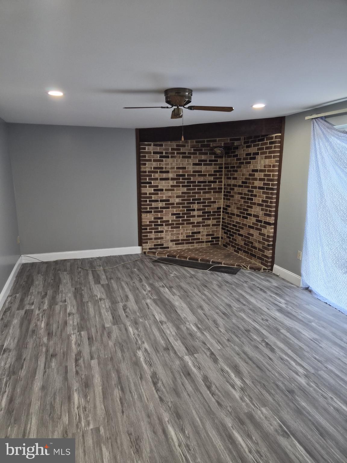 7120 Winter Rose Path Columbia, MD 21045 - Photo 24 of 28 a view of an empty room and wooden floor