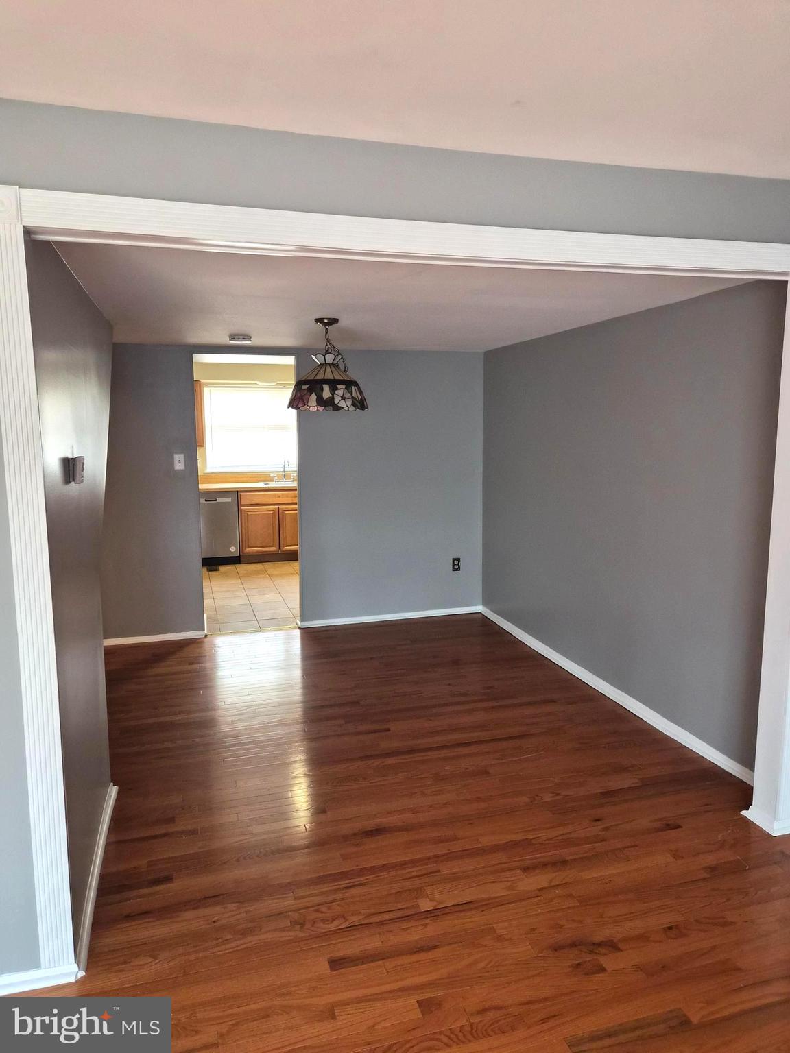 7120 Winter Rose Path Columbia, MD 21045 - Photo 8 of 28 a view of empty room with wooden floor
