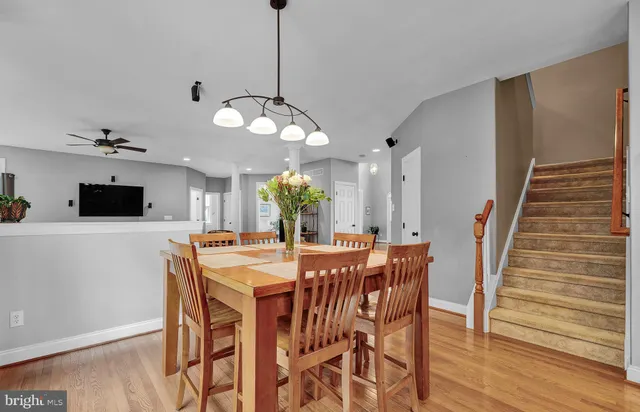 a spacious bedroom with a large bed and a chandelier