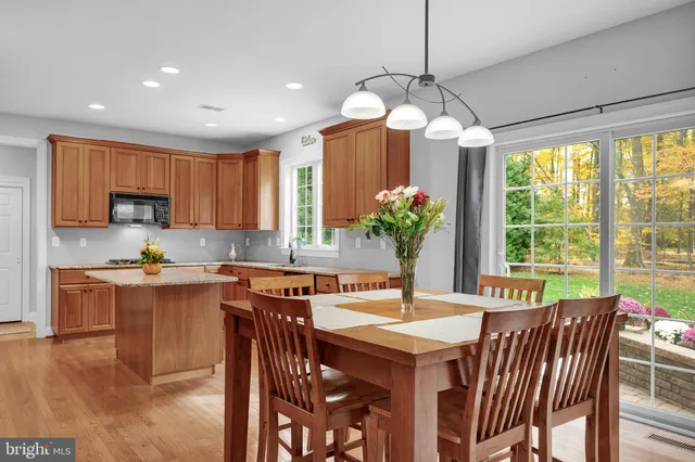 a spacious bedroom with a bed and a chandelier