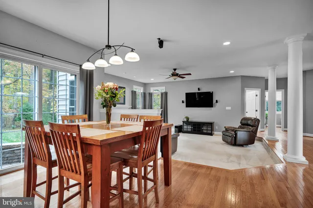 a spacious bedroom with a bed and a television