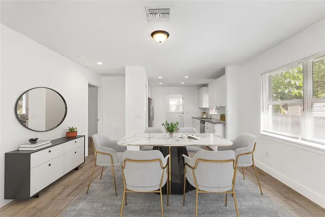 a view of a dining room with furniture window and outside view