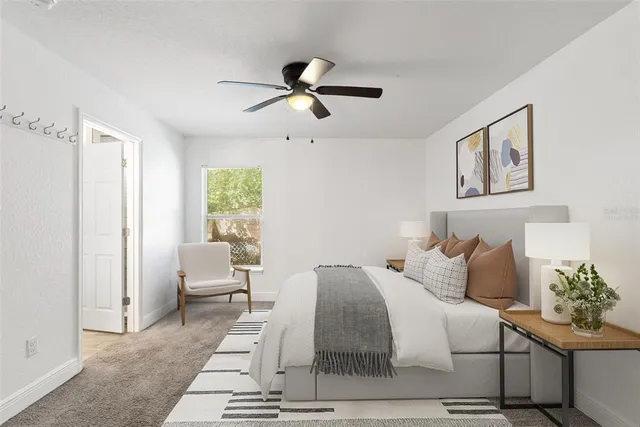 a bedroom with a bed and window