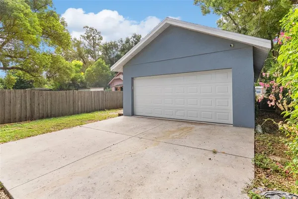 a view of a house with a yard and garage